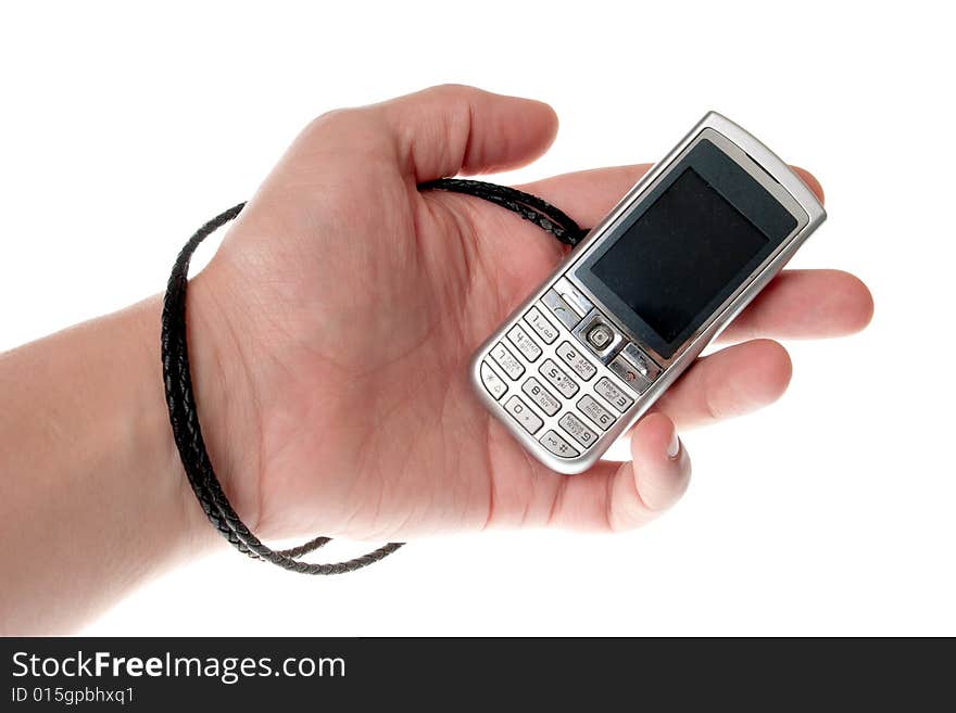 Small Silver Mobile Phone Device in hand. Small Silver Mobile Phone Device in hand