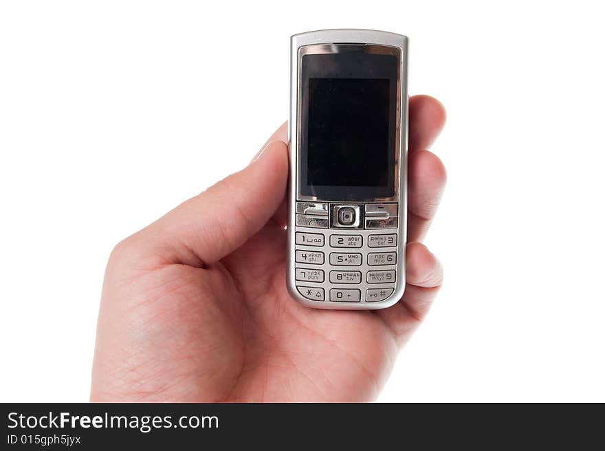 Small Silver Mobile Phone Device in hand. Small Silver Mobile Phone Device in hand