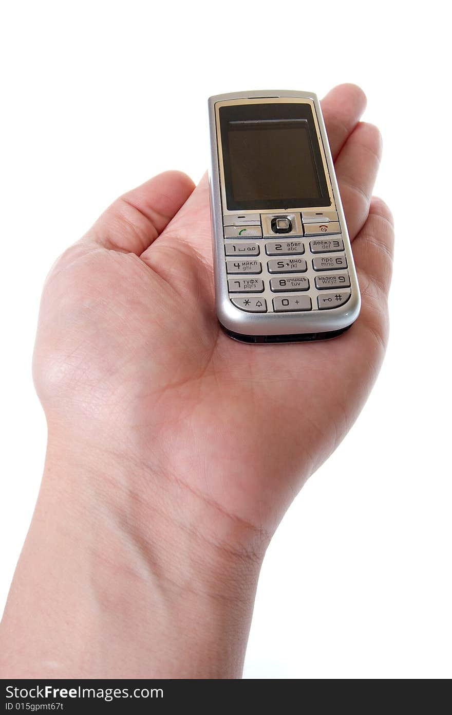 Small Silver Mobile Phone Device in hand. Small Silver Mobile Phone Device in hand