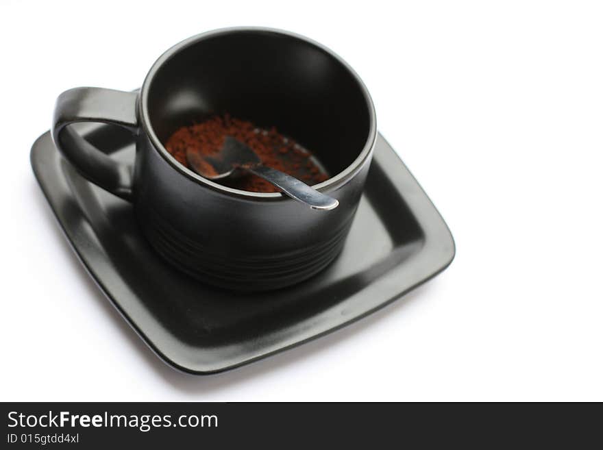 A cup of coffe without water against a white background.