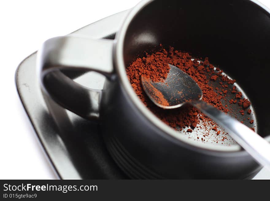 A cup of coffe without water against a white background.