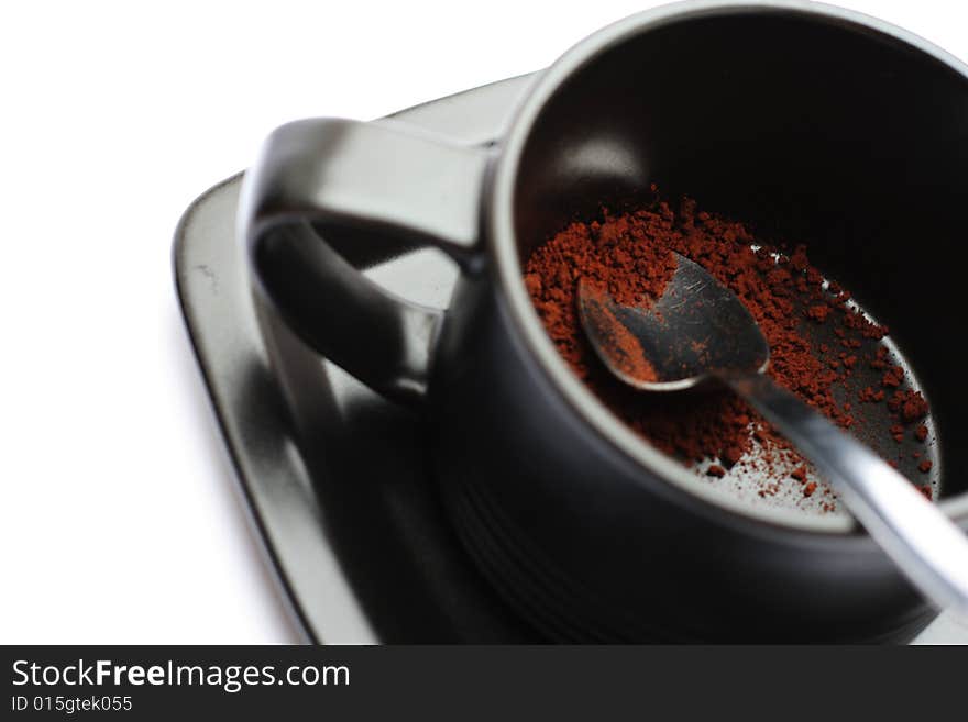 A cup of coffe without water against a white background.