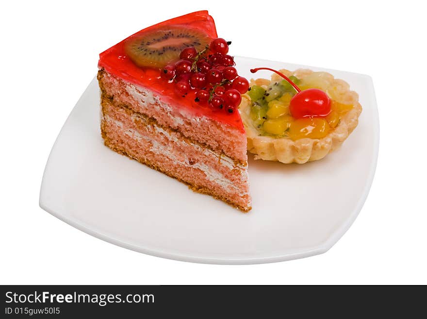 Sweet cakes with fruit on a white background