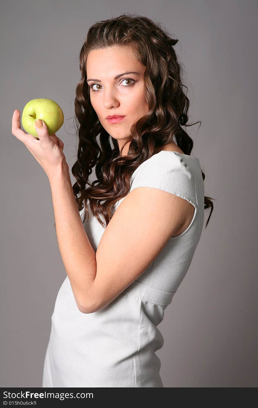 Young woman with green apple. Young woman with green apple