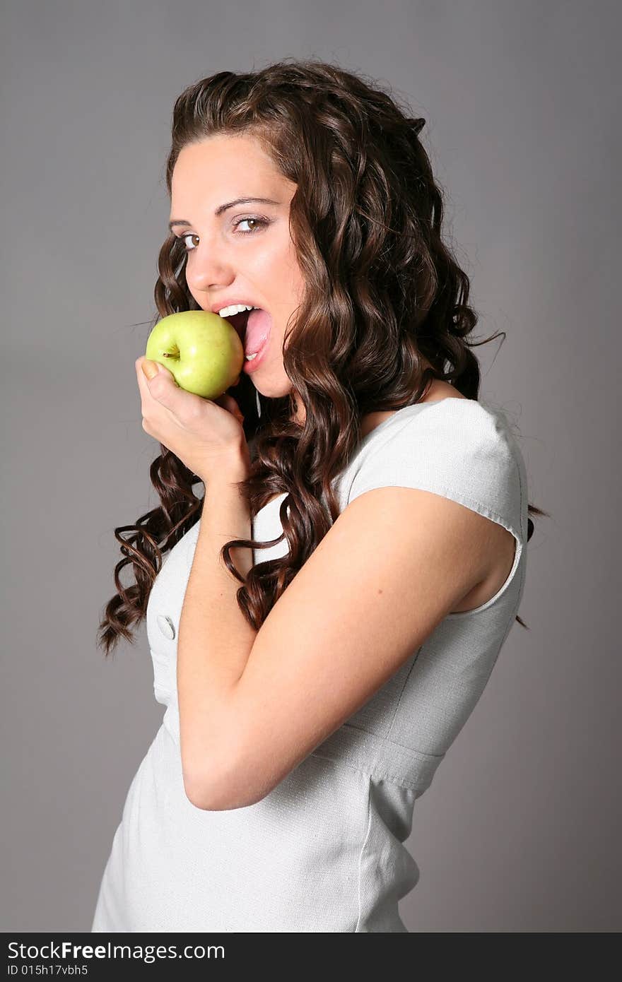 Young woman with green apple. Young woman with green apple