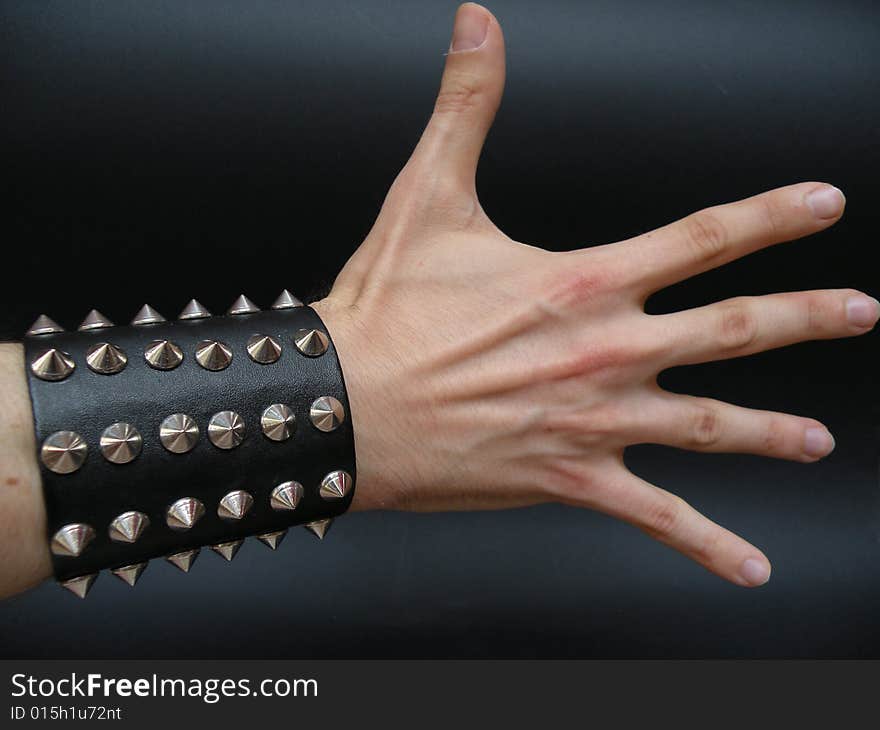 White hand on air and all finger open,black leather with metal on this hand.