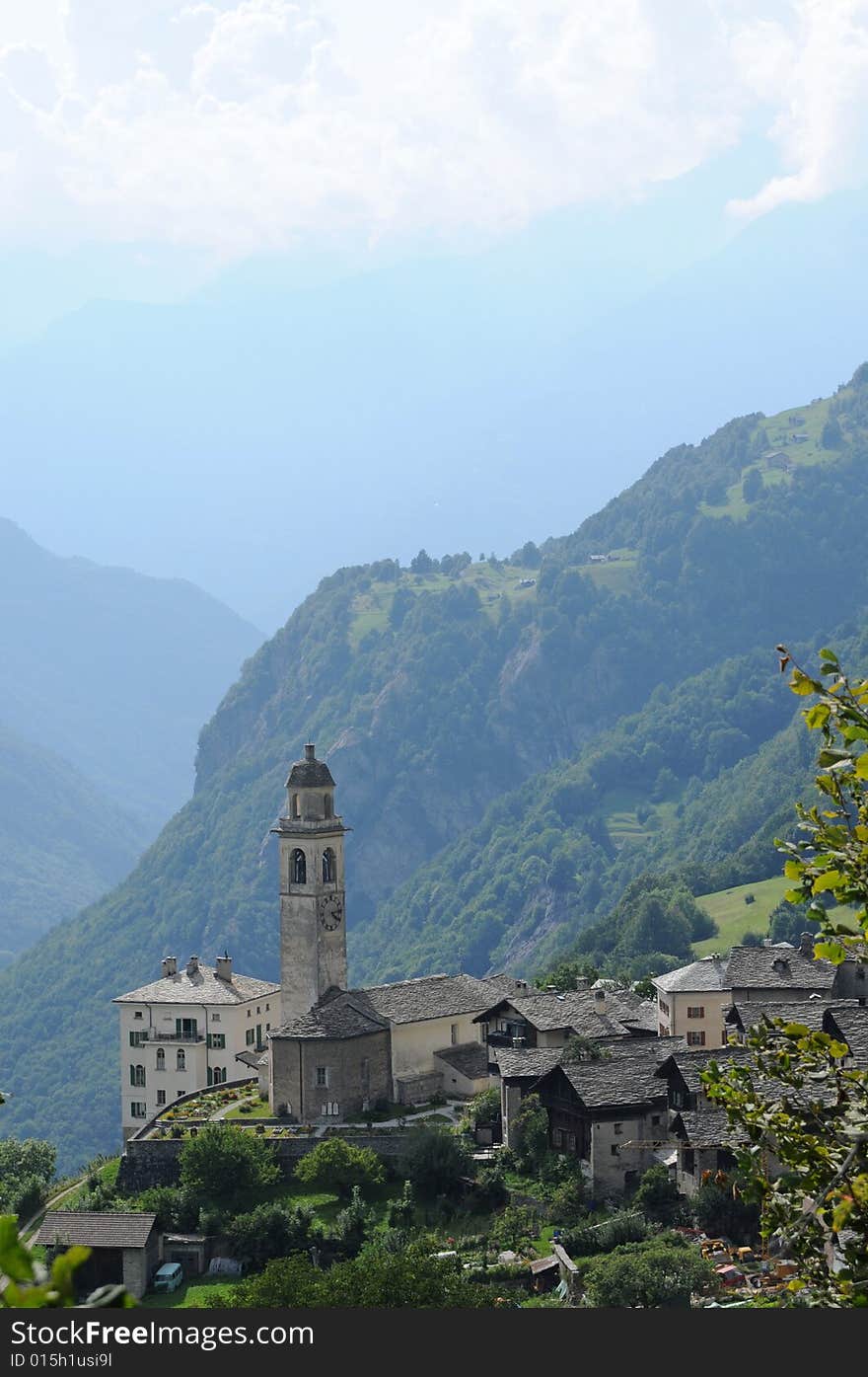 Lovely panorama in the alps in switzerland featuring an old church. Lovely panorama in the alps in switzerland featuring an old church