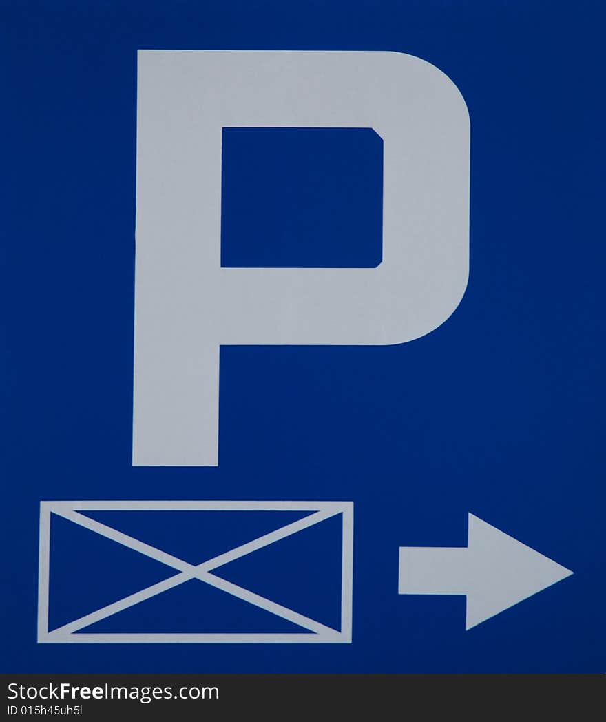 Parking blue sign lit up. Parking blue sign lit up