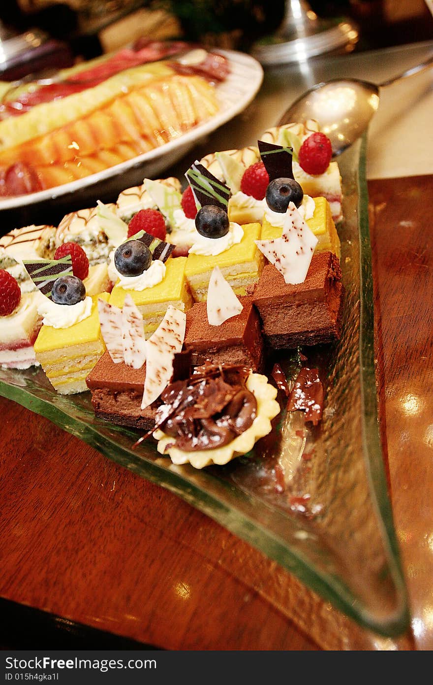 Variety of dessert cake on a glass plate