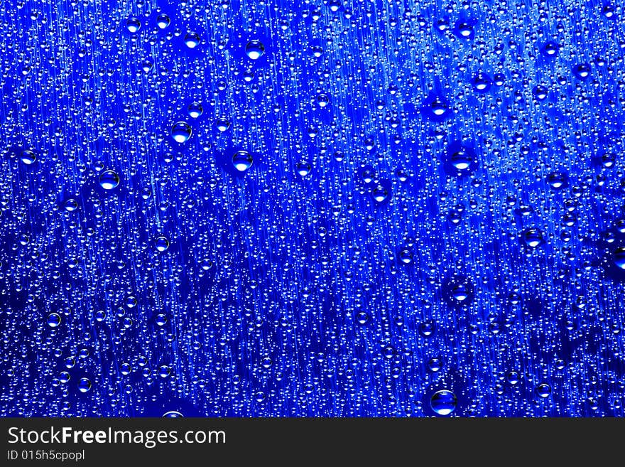 Drops of water on a blue background. Drops of water on a blue background.