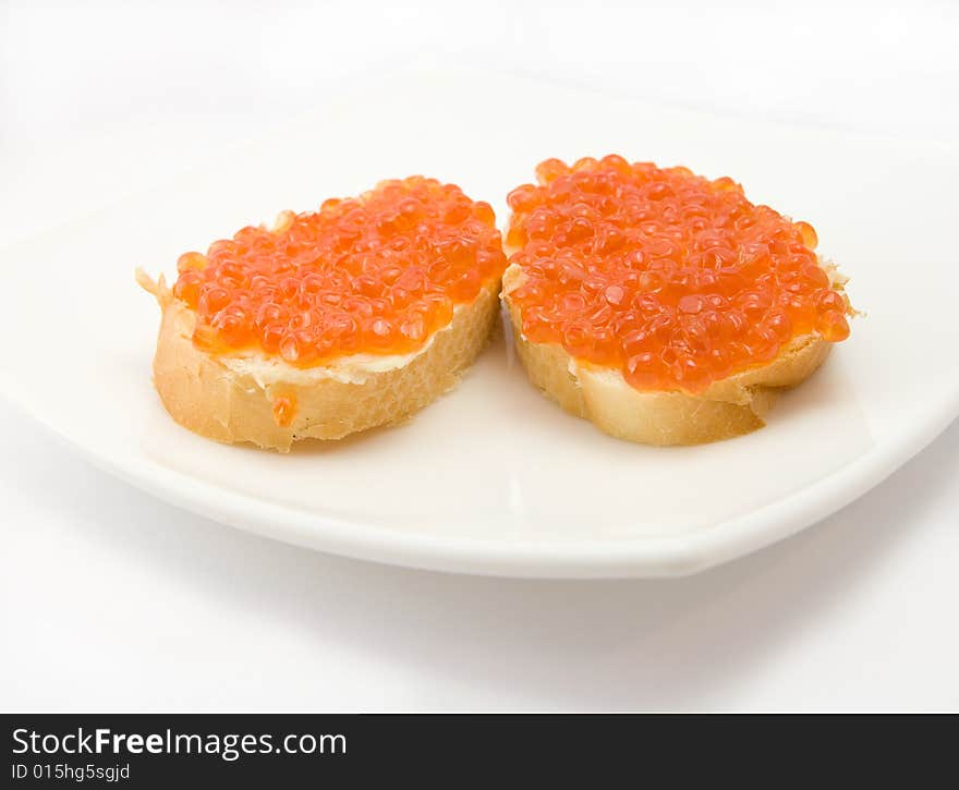 Sandwiches with caviar on plate