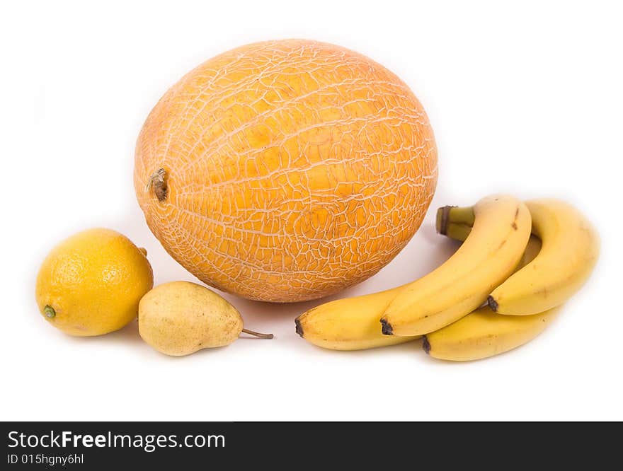 Yellow pear melon bananas and lemon on white background. Yellow pear melon bananas and lemon on white background