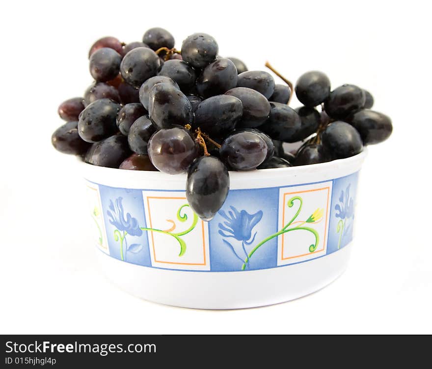 Black grapes isolated on white