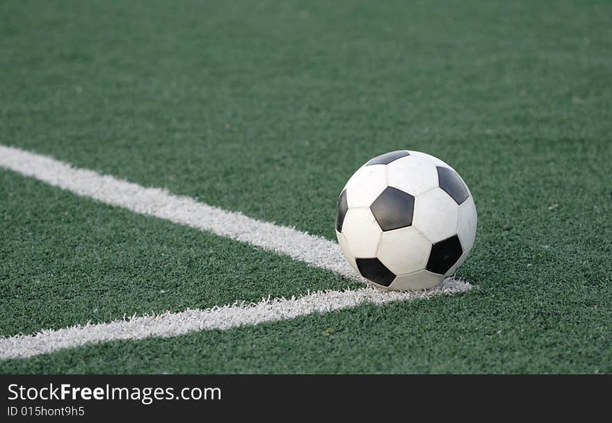 Football in stadium with an artificial covering before the beginning of game.