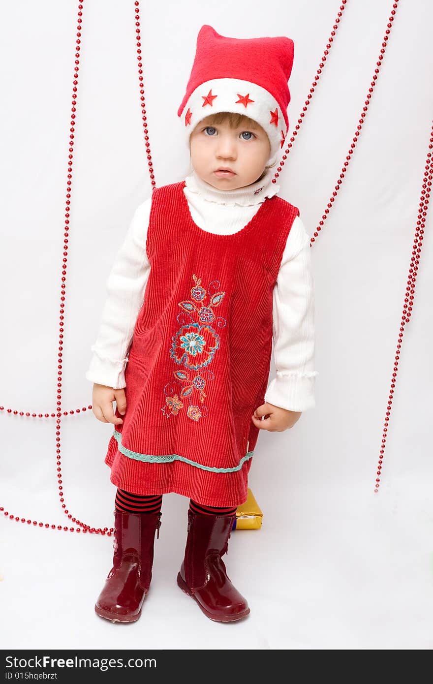 Happy infant with gifts in the decorated christmas box;