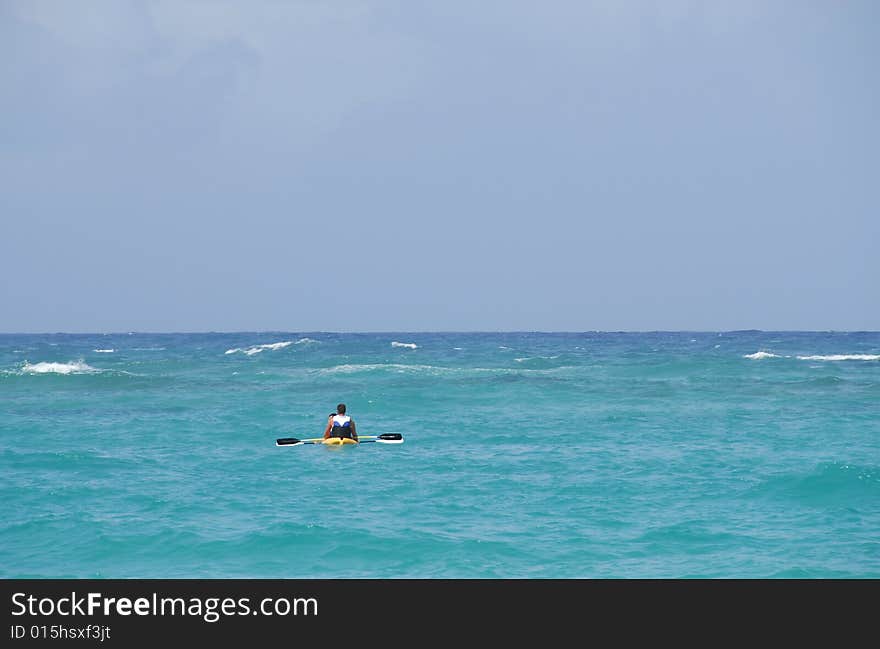 People in a canoe paddle (kayak), the Caribbean Sea