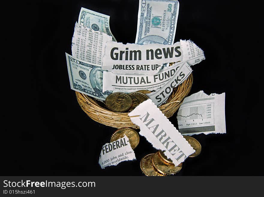 Newspaper clipping and money in a nest. Newspaper clipping and money in a nest.