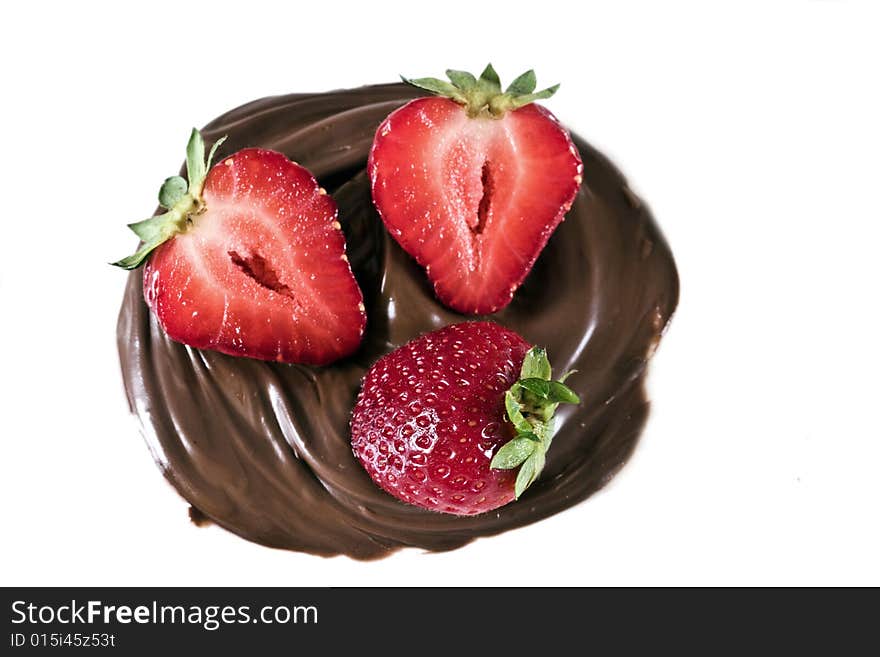 Strawberry in chocolate whirl on a white background