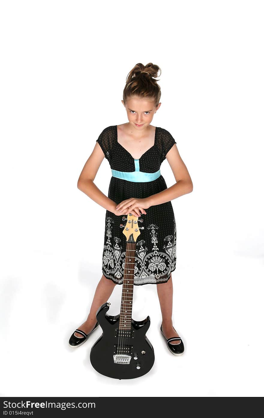 Pretty girl in black dress with electric guitar