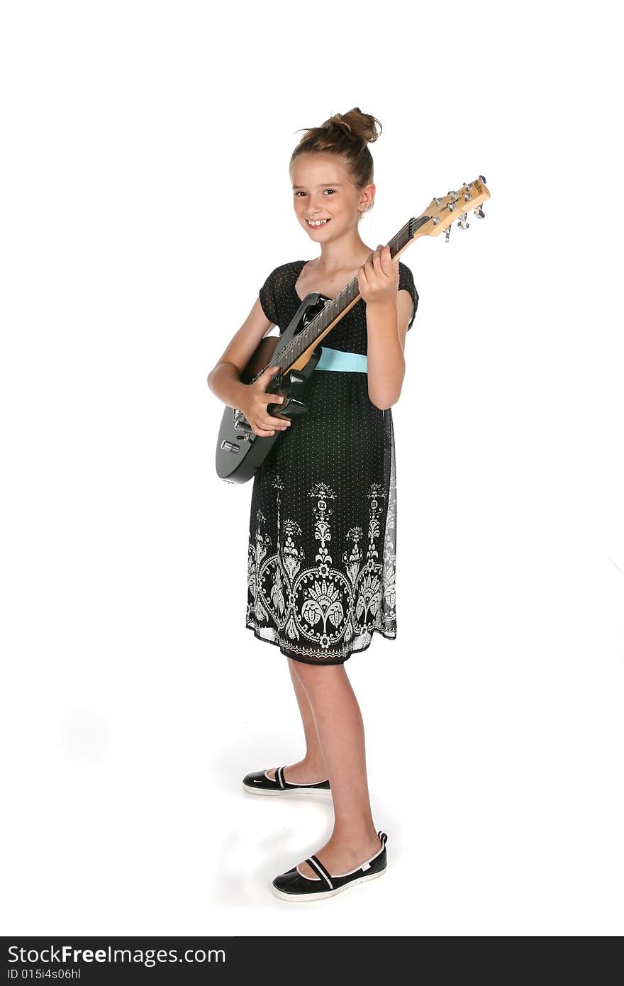 Cute young girl holding electric guitar