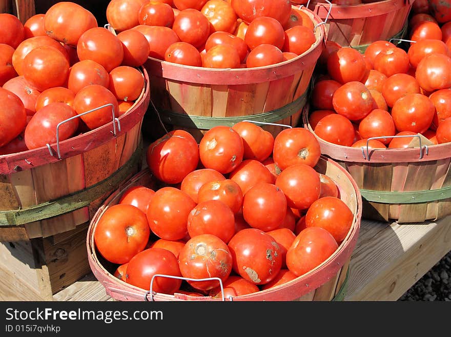 Tomatoes in baskets at the farm stand