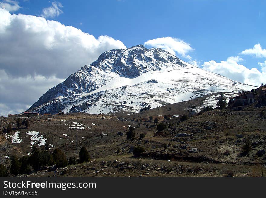 A beautiful mountain covered in snow. A beautiful mountain covered in snow