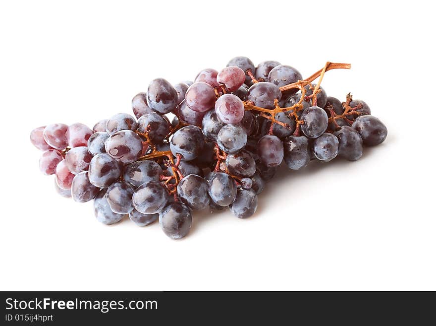 Isolated purple ripe grape berries on white