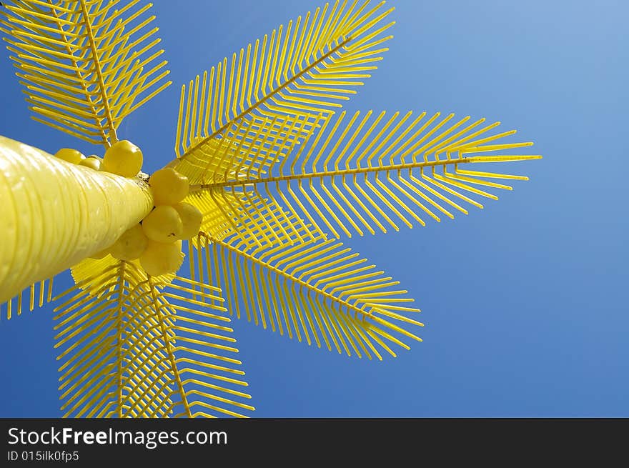 Yellow palms on beach with sky background. Yellow palms on beach with sky background