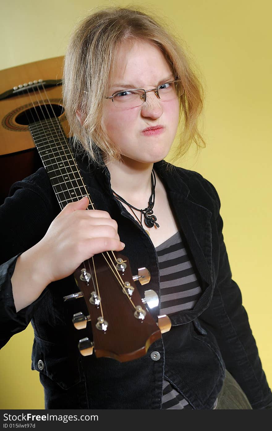 Young girl with acoustic guitar. Young girl with acoustic guitar