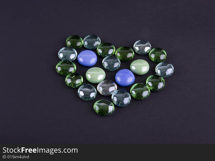 Glass stones making heart shape