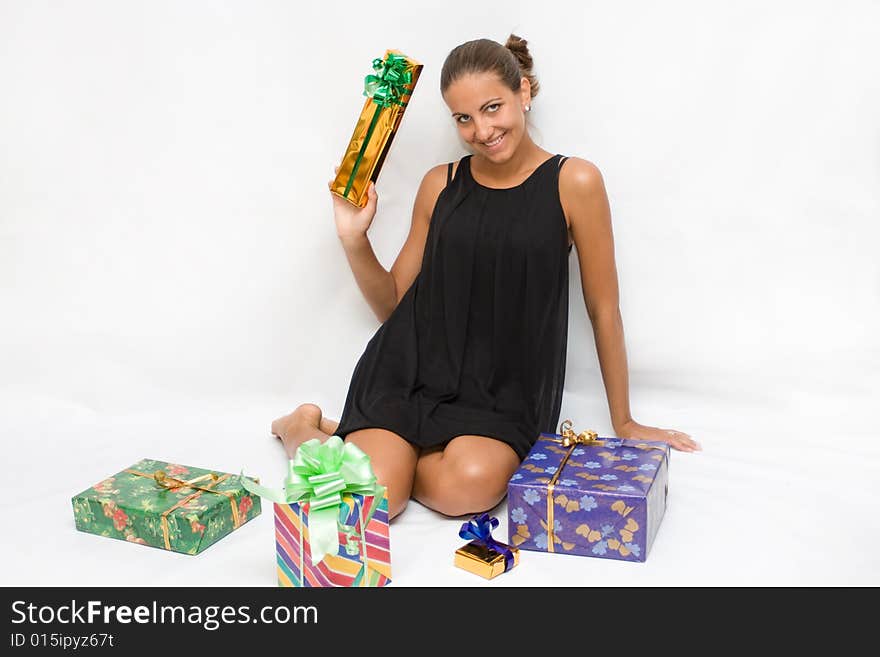 Beautiful girl holding gift boxes