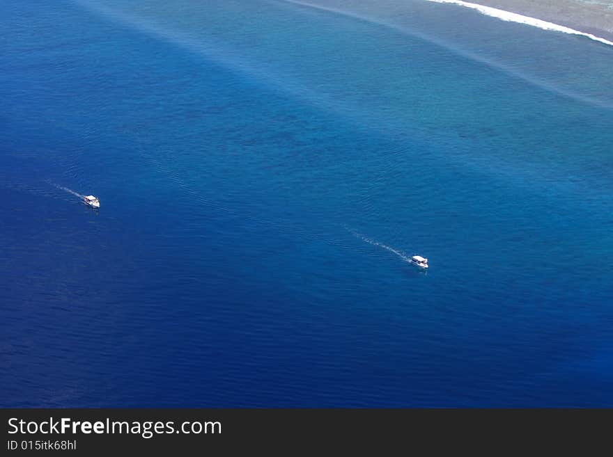 Aerial view of yachts in exotic ocean