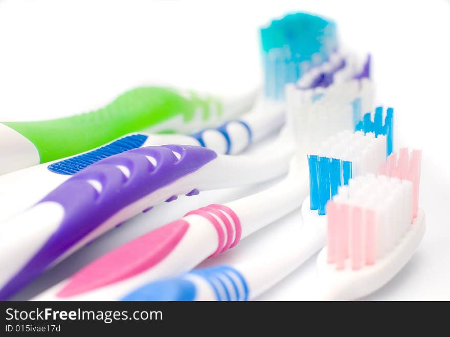 Five new toothbrushes multicolored, isolated