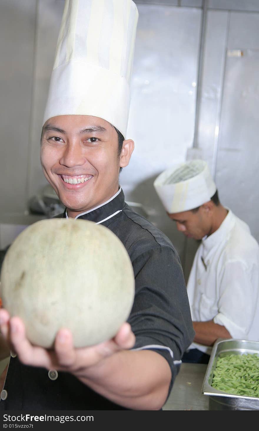 Chef holding honeydew melon