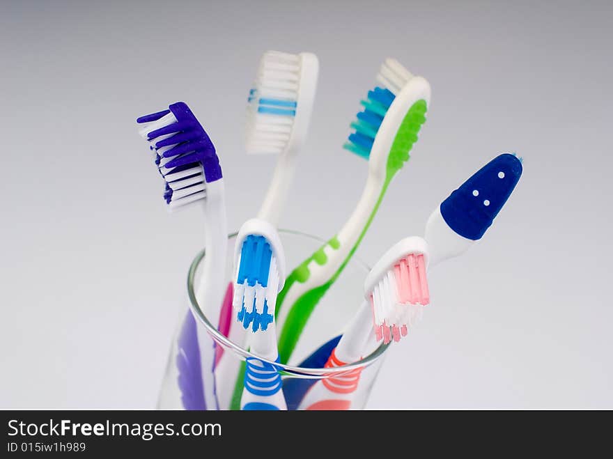 Five new toothbrushes in glass. Five new toothbrushes in glass