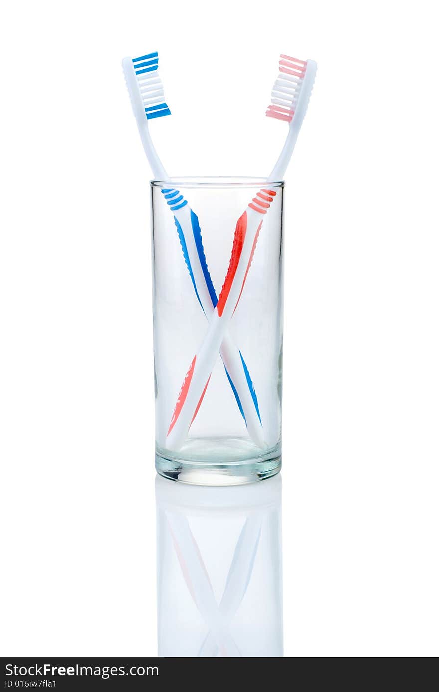 New toothbrush in glass, isolated