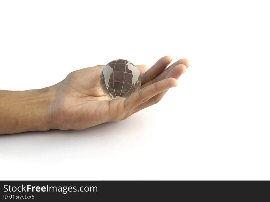 Stock image of a crystal globe in hand. Stock image of a crystal globe in hand