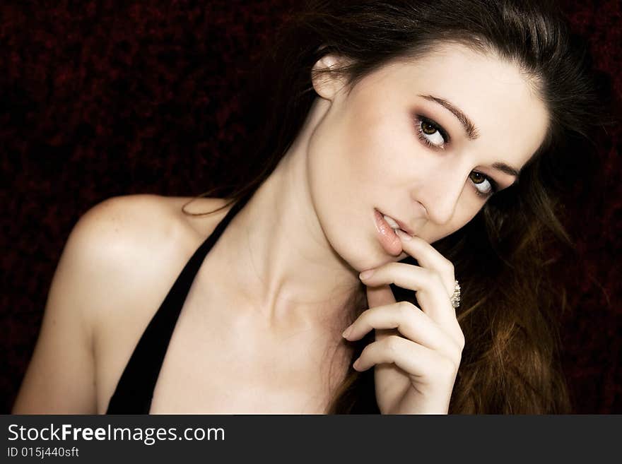 A beautiful young brunette fashion model portrait, studio shot. A beautiful young brunette fashion model portrait, studio shot