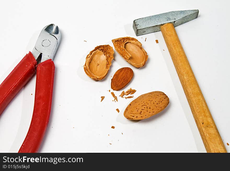 Hammer and clipper for eating almond seed