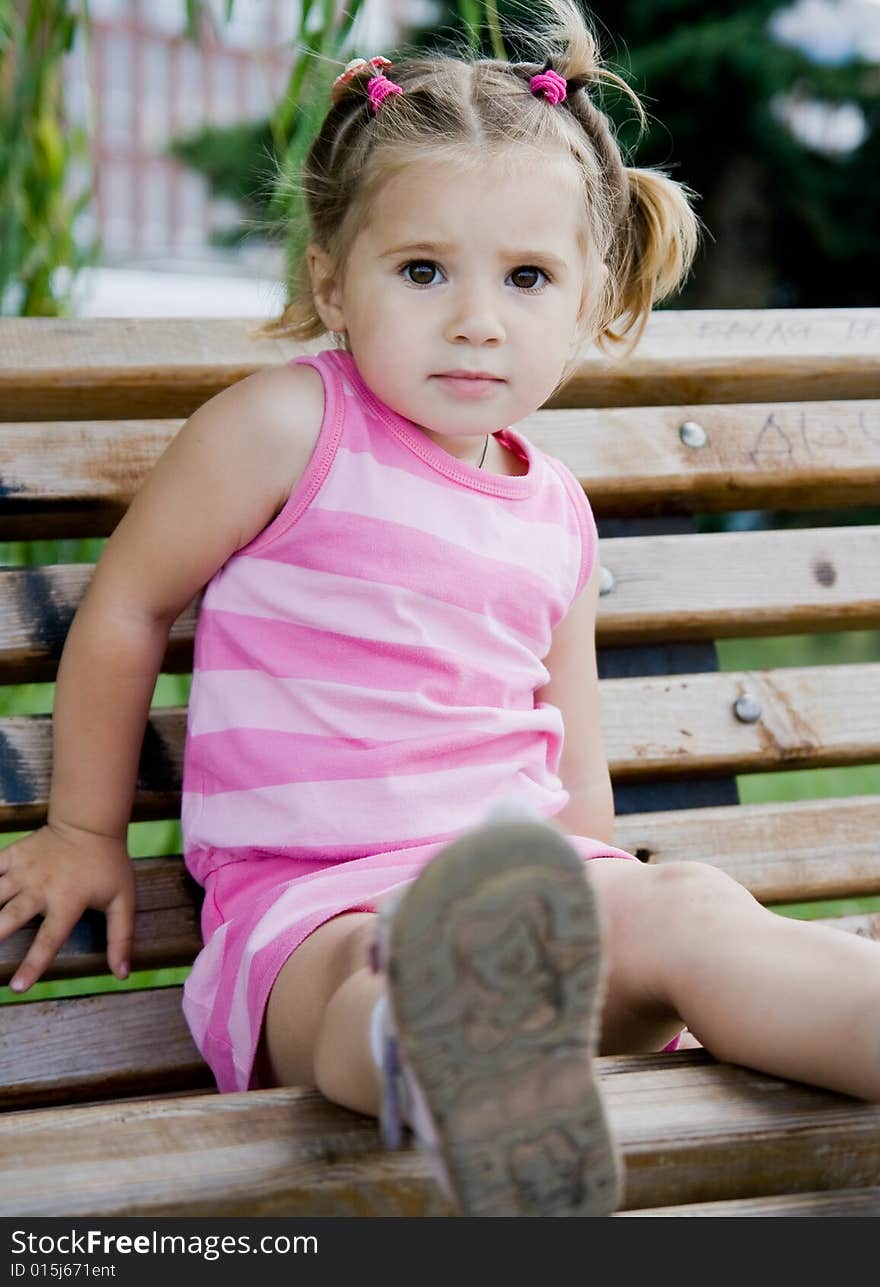 Little girl on the bench