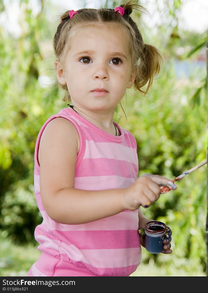 Portrait of little girl playing outdoor