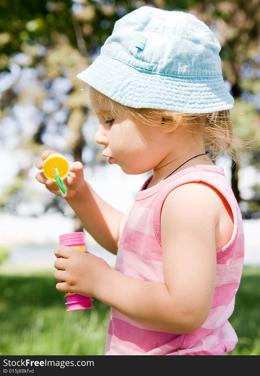 Portrait of girl blowing bubbles