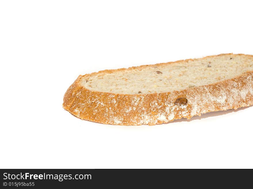 Slice of fresh wholegrain bread on white background