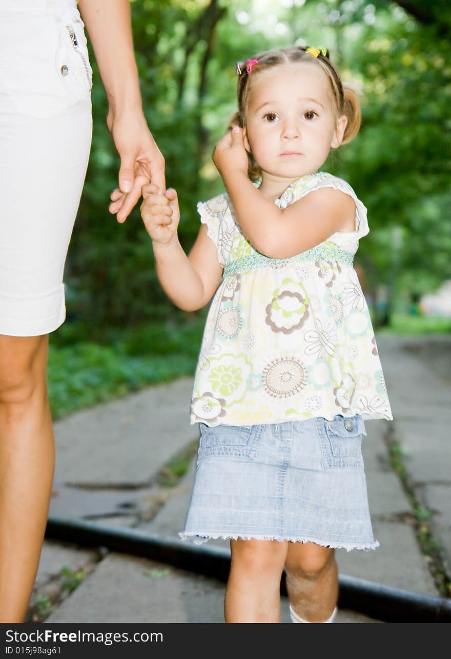 Little girl with mother's hand