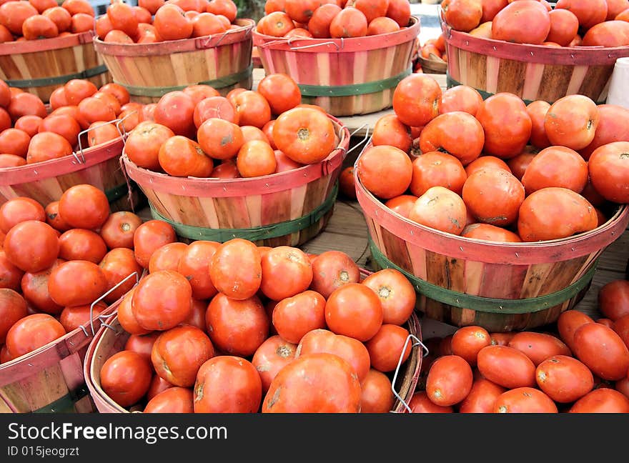 Tomatoes in baskets at the farm stand