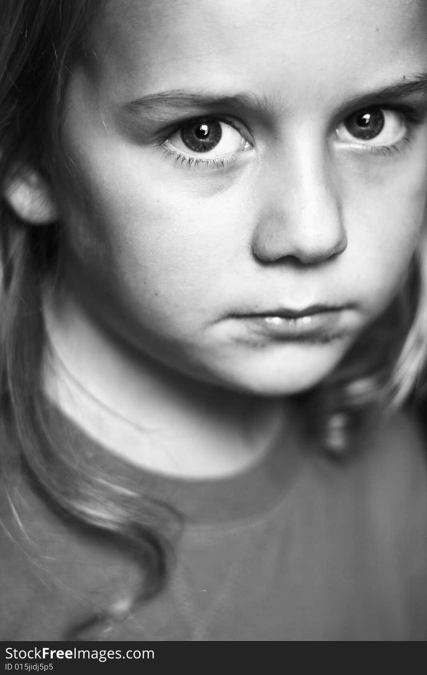 Portrait of boy in black and white with big eyes.