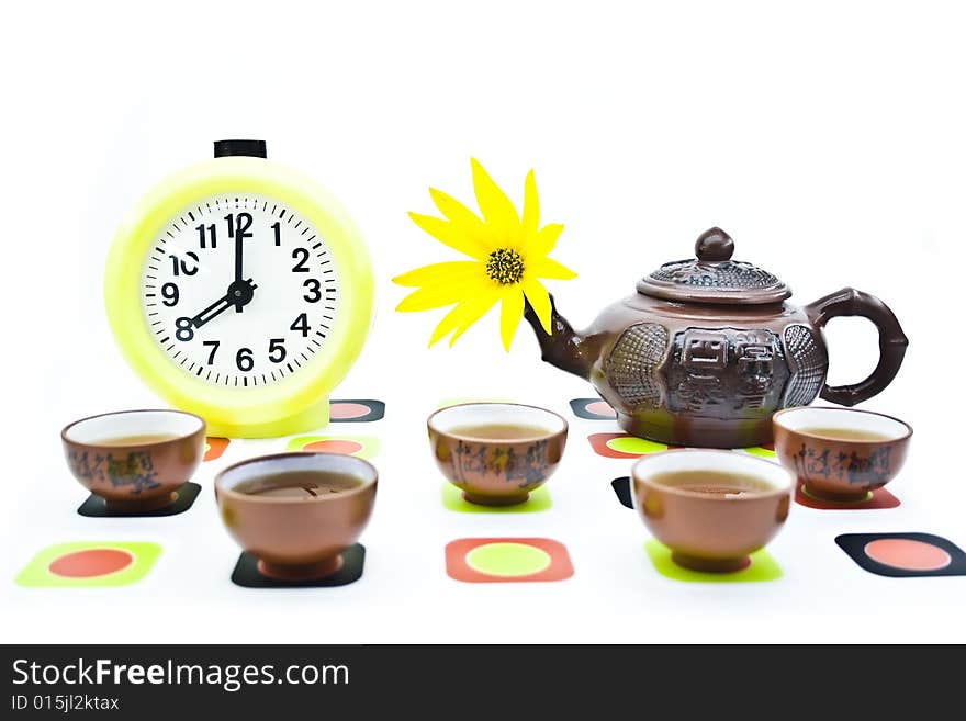 Clay teapots and cups isolated on a white background