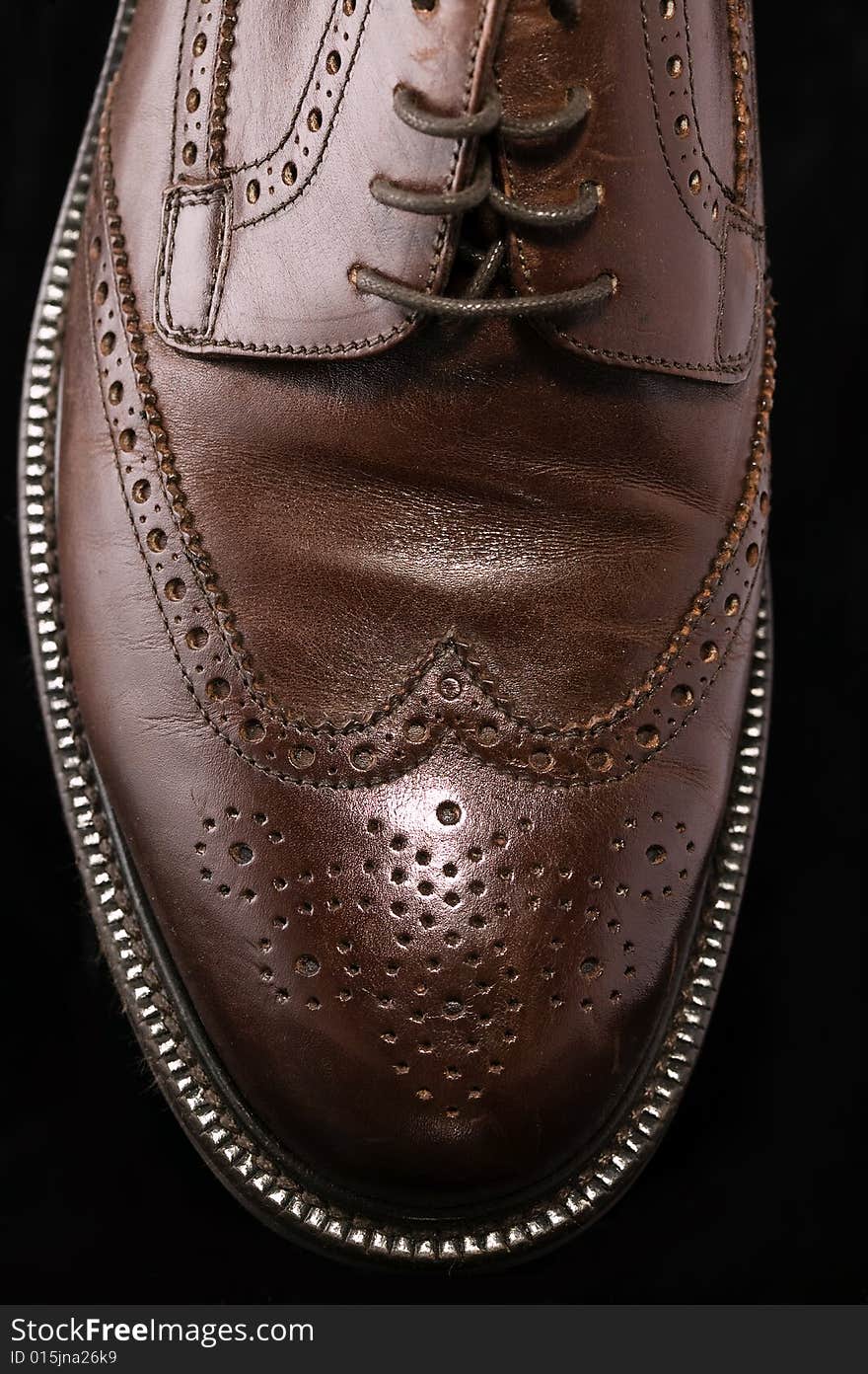 Brown Leather Shoe on Black Background