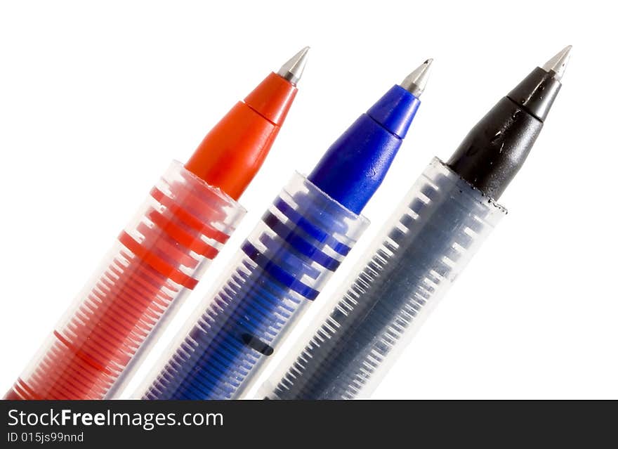 Red, blue and black pens on the white background. Red, blue and black pens on the white background