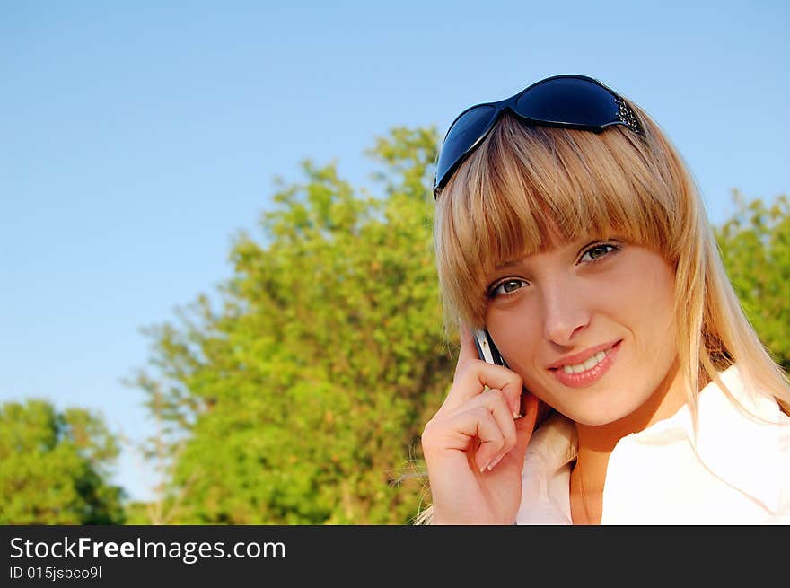 Beautiful young woman speaking the phone